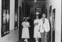 Dr. Brown and nurse patrolling wards, 1957.